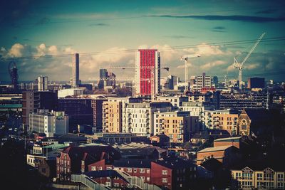 High angle view of buildings in city against sky
