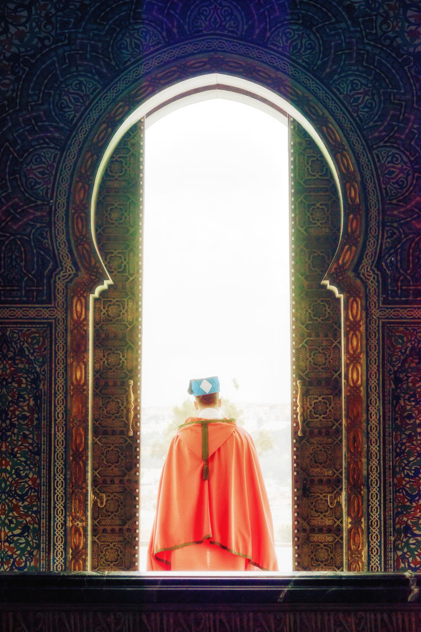 REAR VIEW OF MAN IN TEMPLE