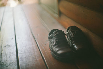 High angle view of shoes on wooden floor