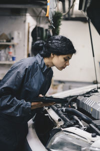 Side view of woman working