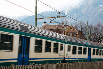 Train at railroad station against sky