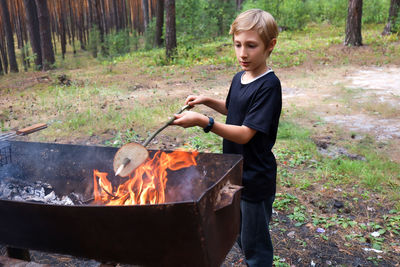 Full length of a boy in the forest