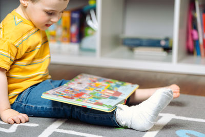 Close-up of boy drawing on table