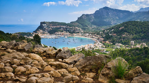 Scenic view of sea and mountains against sky