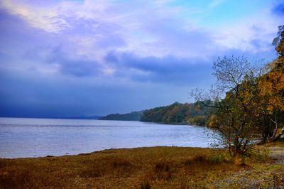 Scenic view of landscape against cloudy sky