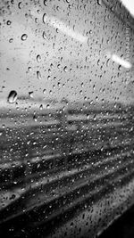 Close-up of water drops on window