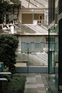 Buildings seen through glass window of building