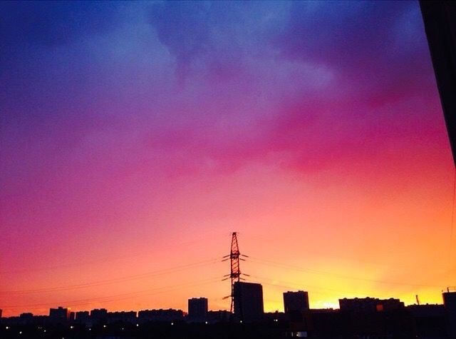 sunset, building exterior, architecture, built structure, silhouette, city, orange color, sky, cityscape, low angle view, skyscraper, urban skyline, dusk, building, outdoors, no people, romantic sky, dramatic sky, copy space, scenics