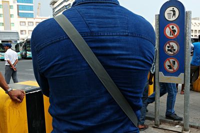 Man looking at city street