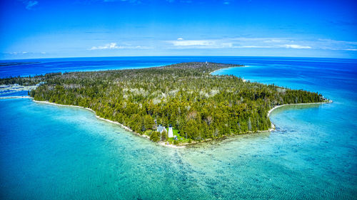 Scenic view of bay against clear blue sky