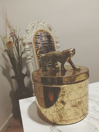 Close-up of a statue on table at home