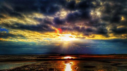 Scenic view of sea against cloudy sky