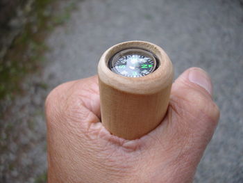 Close-up of cropped hand holding glass