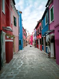 Alley amidst buildings in city