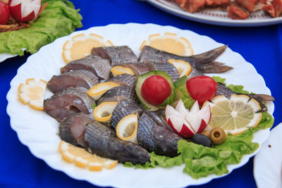 High angle view of fruits in plate on table