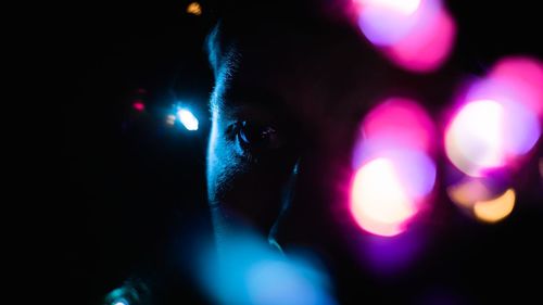 Close-up portrait of illuminated light painting at night