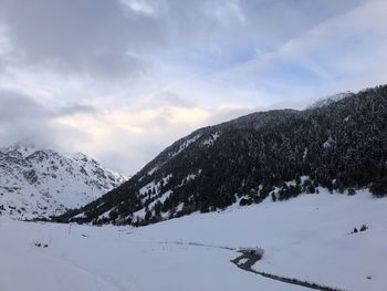 Snow covered mountains against sky