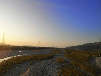 Scenic view of river against sky during sunset