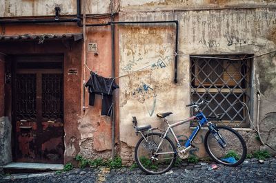 Bicycle parked against wall