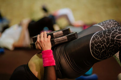 Midsection of woman exercising at gym