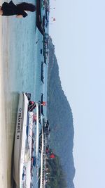 High angle view of boats in sea against clear sky