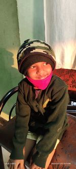 Portrait of boy wearing hat during winter