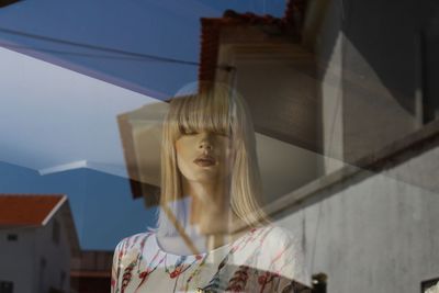 Low angle view of woman against sky