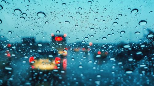 Close-up of raindrops on glass window