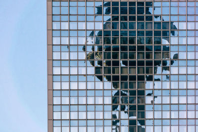 Reflection on modern building against sky