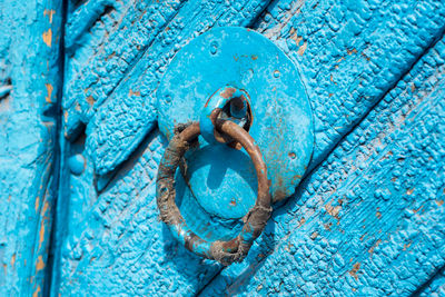 Close-up of blue door knocker