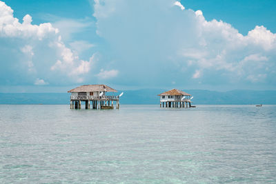 Scenic view of sea and building against sky