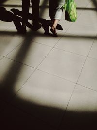 Low section of woman standing on floor