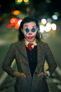 Portrait of smiling woman wearing joker make up