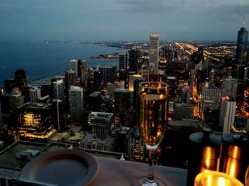 Illuminated cityscape against sky