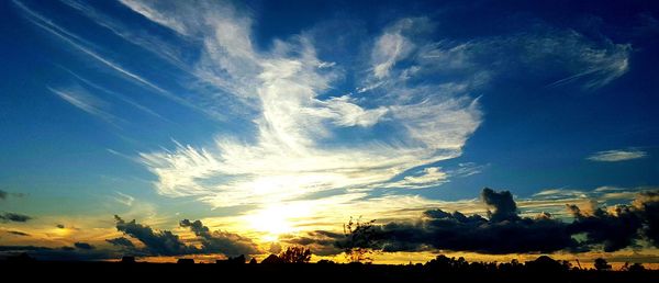 Scenic view of landscape against cloudy sky