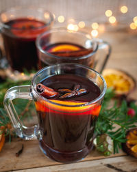 Close-up of christmas mulled wine on wooden background