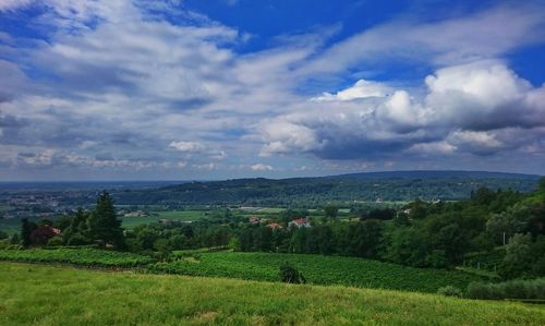 Scenic view of landscape against cloudy sky