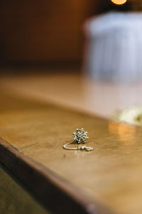Close-up of jewelry on wooden table