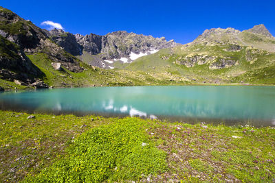 Alpine mountain wide angle lens landscape and mountain reflections in okhrotskhali in svaneti,