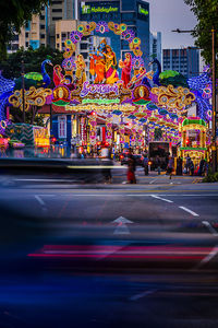 Illuminated city street at night