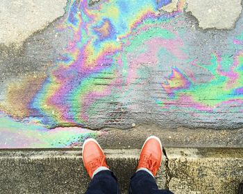 Low section of person standing on ground