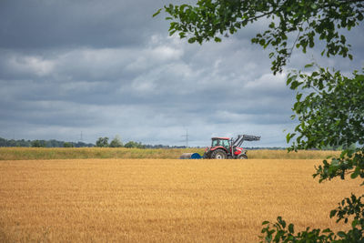 Combine harvester on agricultural field