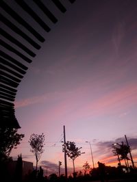 Low angle view of silhouette trees against sky during sunset