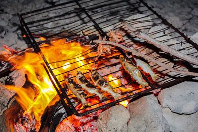 High angle view of bonfire on barbecue grill