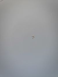 Low angle view of airplane flying in sky