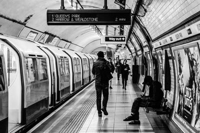 People by train at subway station