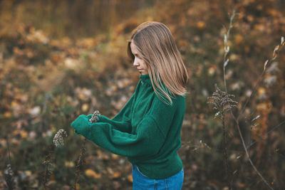 Woman standing on field