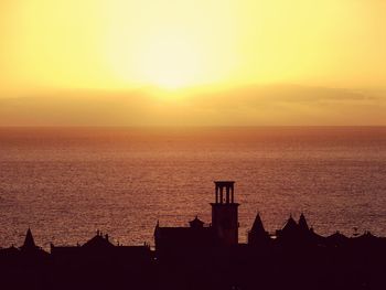 Scenic view of sea at sunset