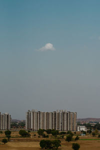 Buildings in city against sky