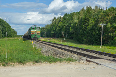 Train on railway tracks against sky